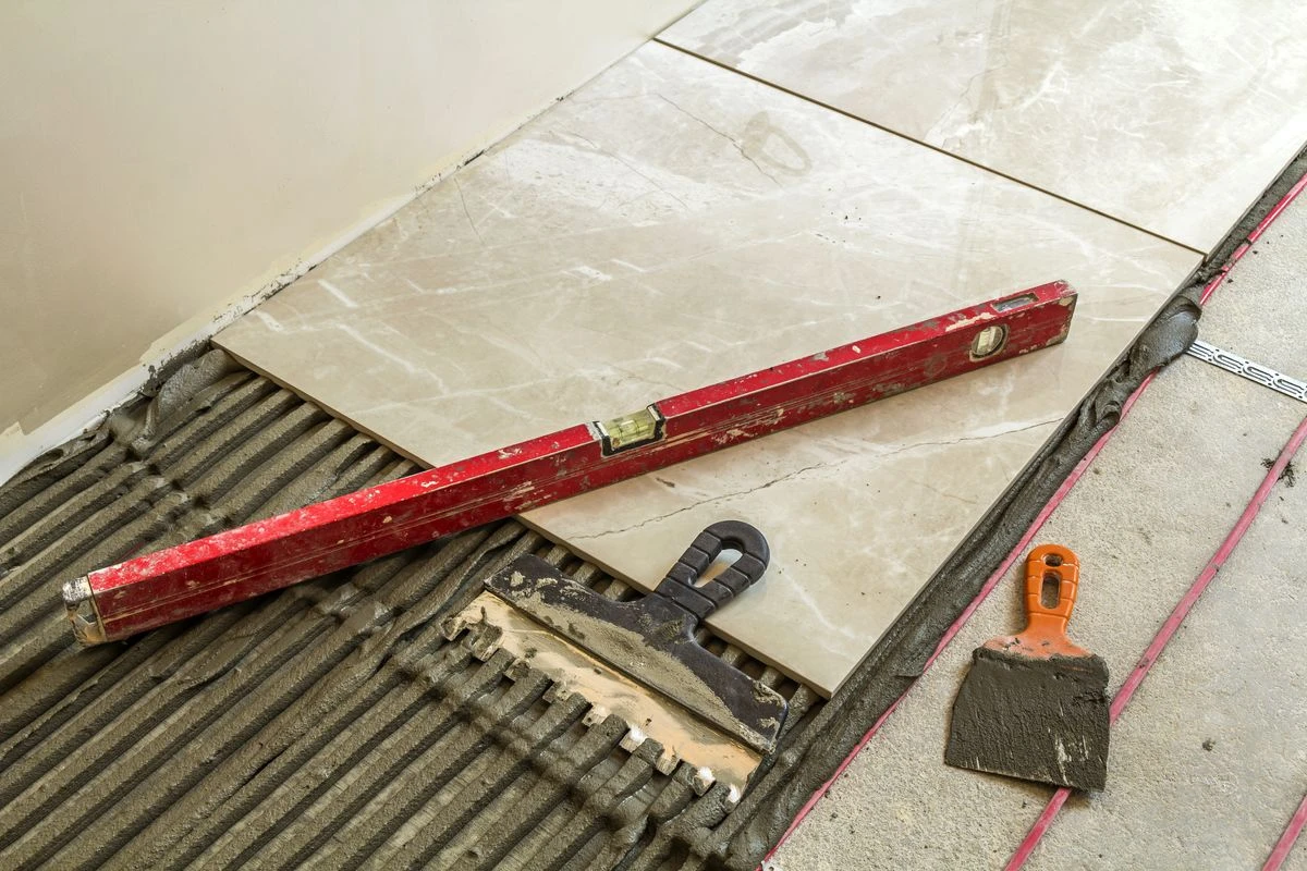 Expert tiling installation showing ceramic tiles in modern bathroom renovation